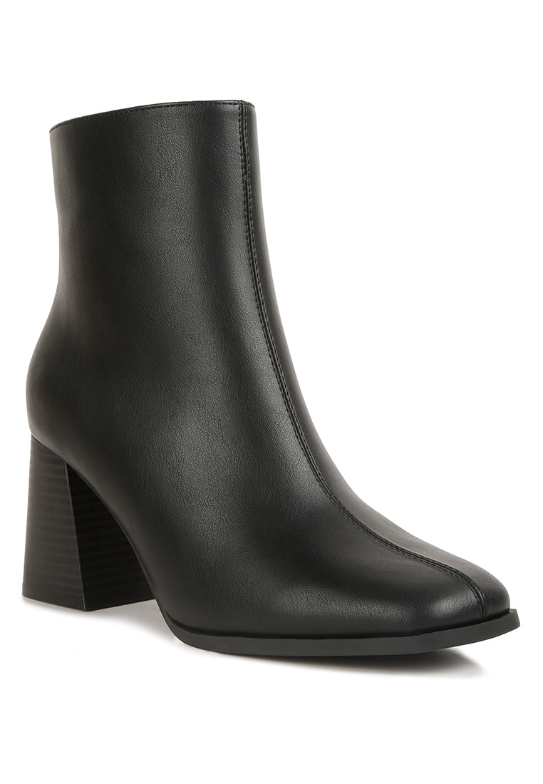 Cox Cut Out Block Heeled Chelsea Boots featuring a stylish cut-out design, wooden block heel, and zip fastening.