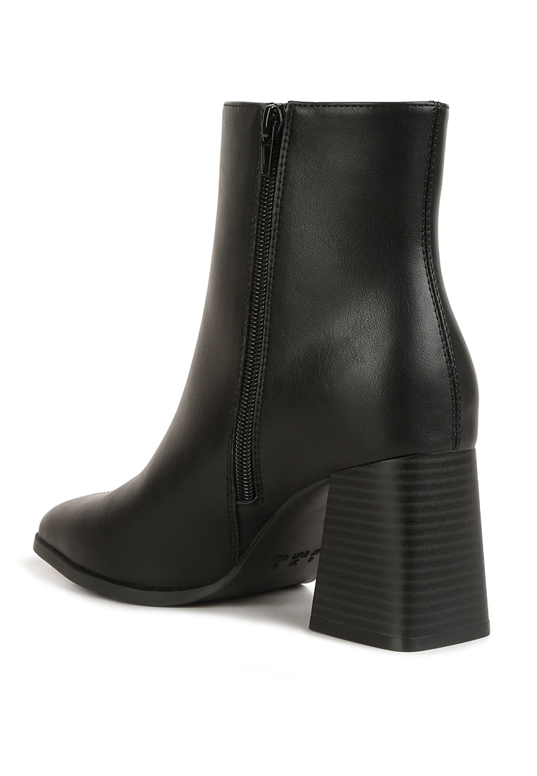 Cox Cut Out Block Heeled Chelsea Boots featuring a stylish cut-out design, wooden block heel, and zip fastening.