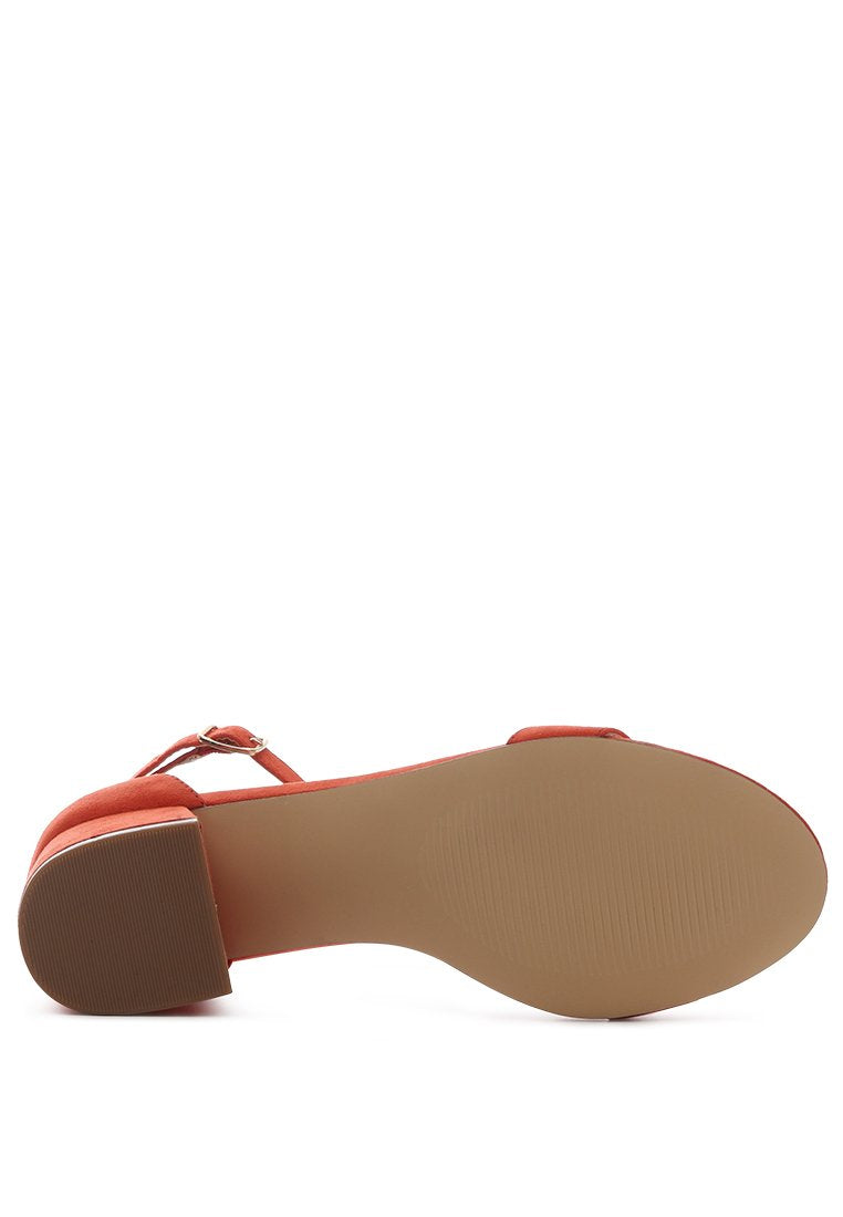 Ecrin Suede Block Heel Sandals in black with a stylish design and ankle strap.