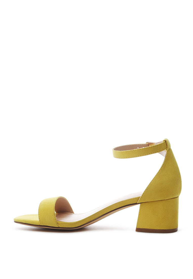 Ecrin Suede Block Heel Sandals in black with a stylish design and ankle strap.