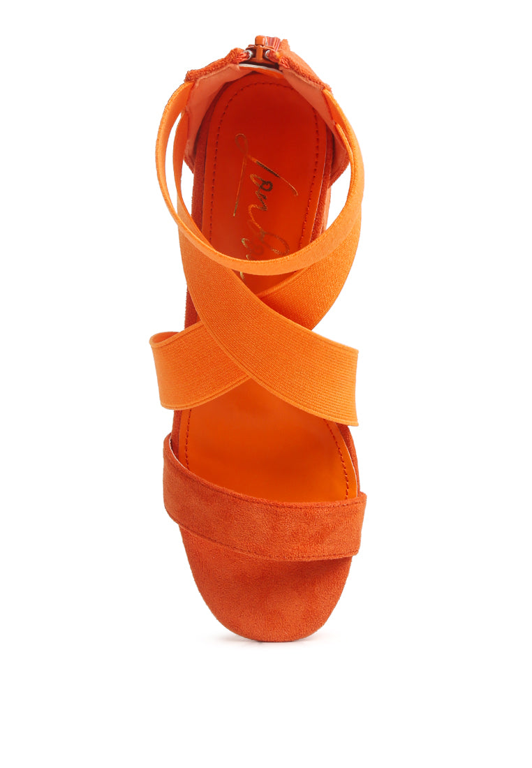 A pair of stylish Elastic Strappy Block Heel Sandals featuring elastic straps, padded insoles, and a back zipper for easy wear.