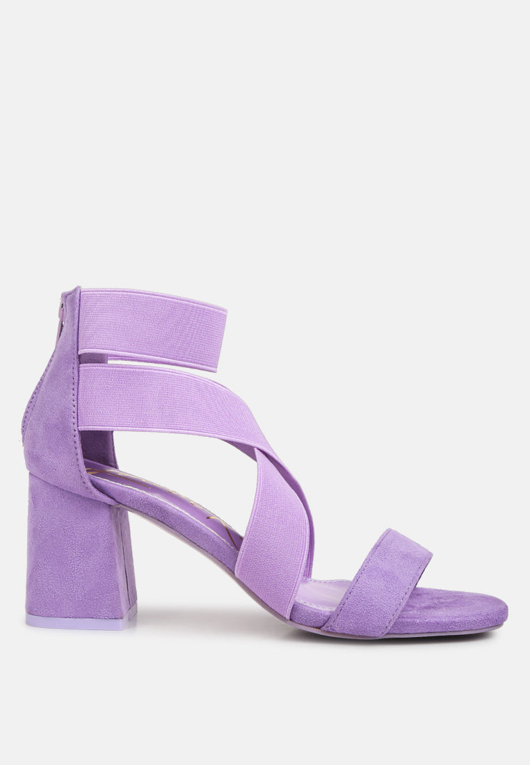 A pair of stylish Elastic Strappy Block Heel Sandals featuring elastic straps, padded insoles, and a back zipper for easy wear.