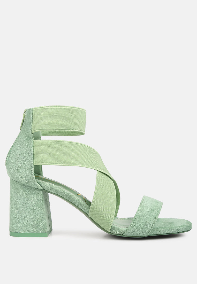 A pair of stylish Elastic Strappy Block Heel Sandals featuring elastic straps, padded insoles, and a back zipper for easy wear.