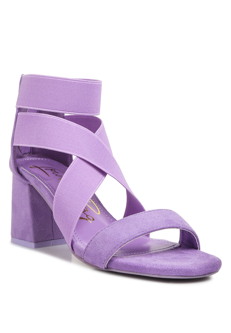 A pair of stylish Elastic Strappy Block Heel Sandals featuring elastic straps, padded insoles, and a back zipper for easy wear.