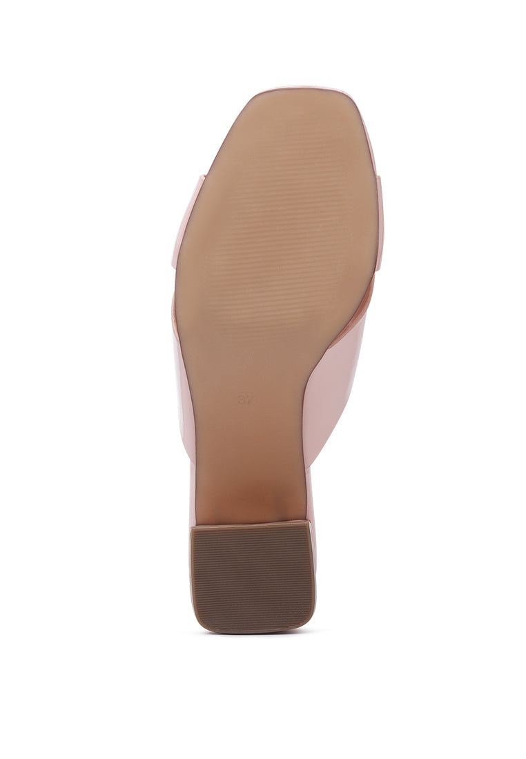 Emine Block Heeled Slip-On Sandals featuring a stylish block heel and open toe design, made from faux leather and faux suede.