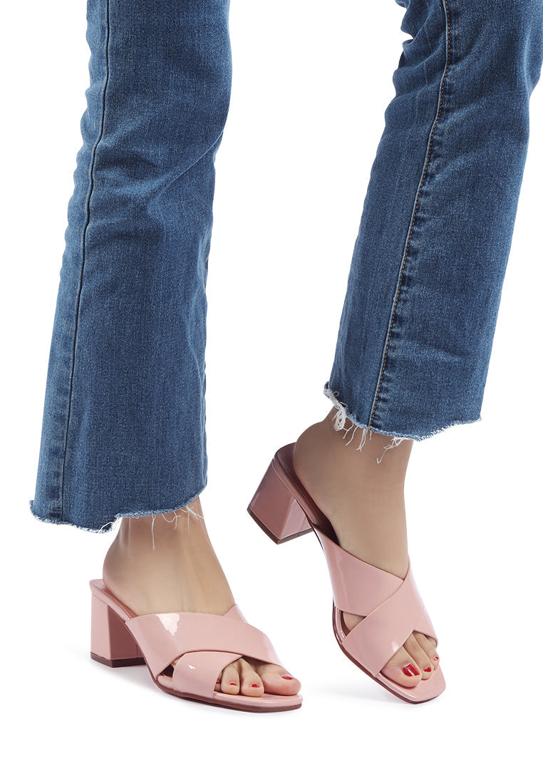 Emine Block Heeled Slip-On Sandals featuring a stylish block heel and open toe design, made from faux leather and faux suede.