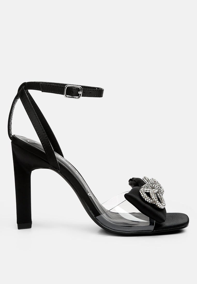 Elegant Etherium Bow Heeled Sandals with oversized bow and pin buckle fastening, crafted from satin with a durable TPR sole.