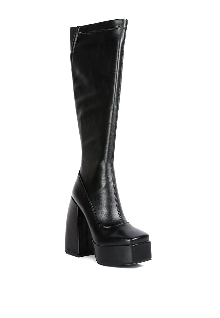 Fanning Platform Long Boots featuring a stylish design with a curved block heel, square toe, and side zipper, made from faux leather.