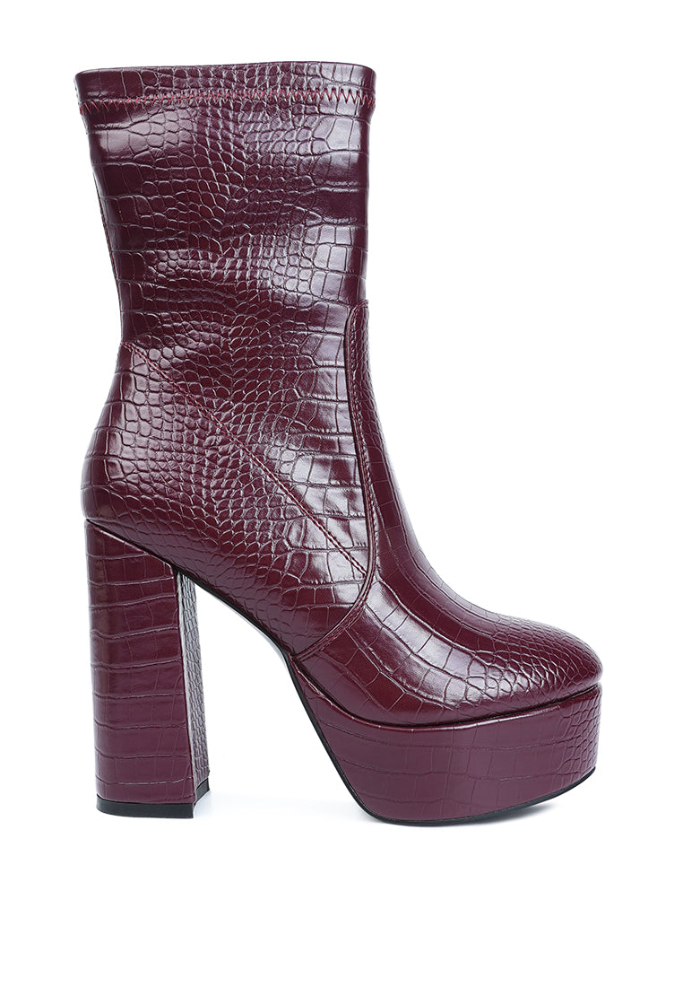 Feral High Heeled Croc Pattern Ankle Boot featuring a pointed toe, block heel, and side zipper in a stylish croc pattern.