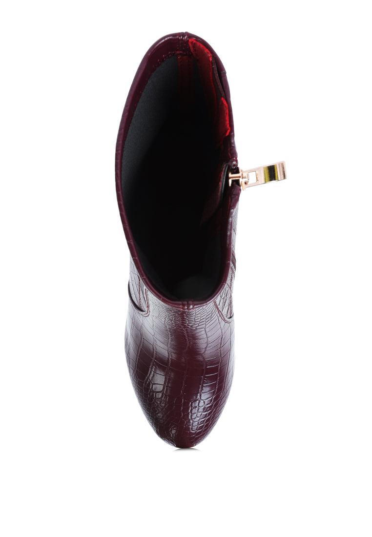 Feral High Heeled Croc Pattern Ankle Boot featuring a pointed toe, block heel, and side zipper in a stylish croc pattern.