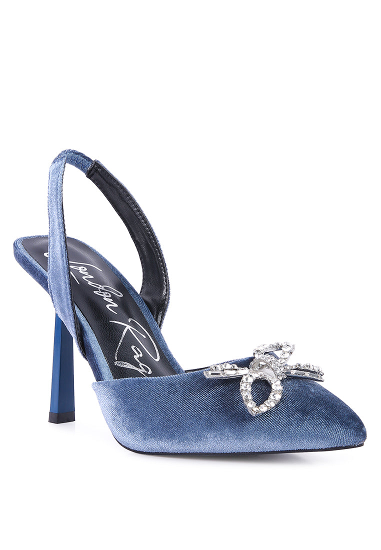 Firebird Pump high-heeled mules in luxurious velvet with a decorative diamante brooch, showcasing a closed pointed toe and elasticated slingback.