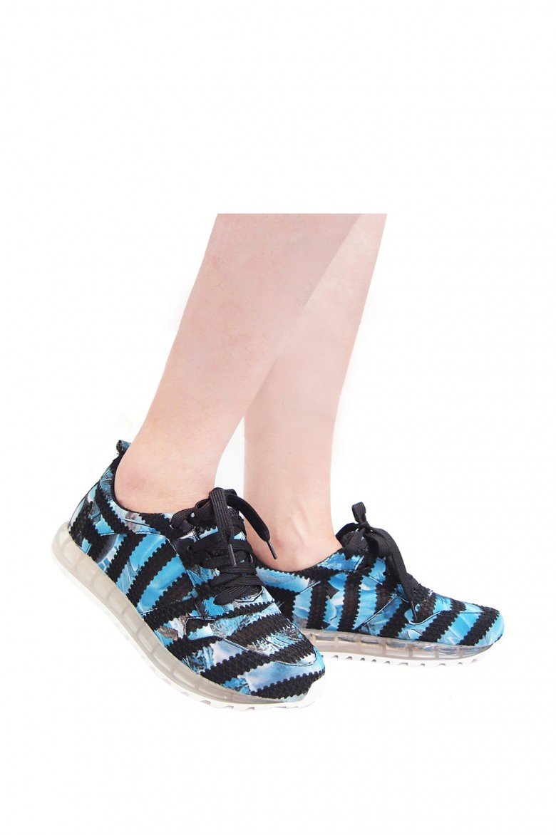 FORREAL shoes featuring a man-made upper, vegan lining, clear midsole, and premium rubber outsole, showcasing a modern and stylish design.