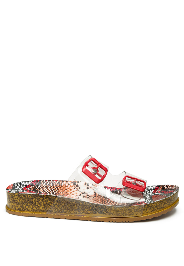 Stylish Gelato Transparent Double Strap Flats featuring clear design, buckled straps, and cork platform for comfort and grip.