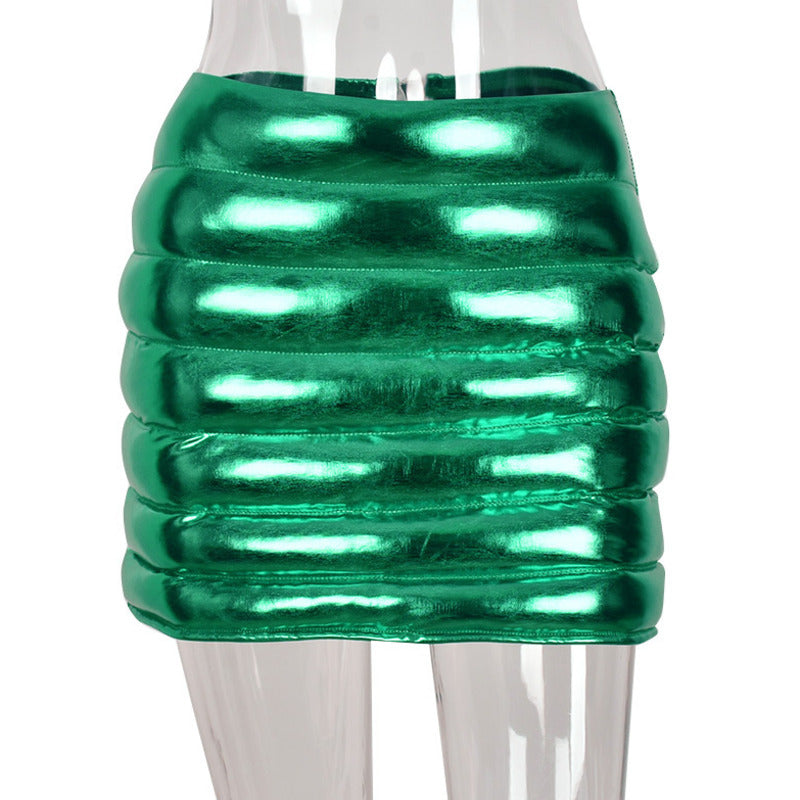 A stylish green women's puffer skirt with a metallic shiny finish, featuring a quilted design and zipper closure, perfect for various occasions.