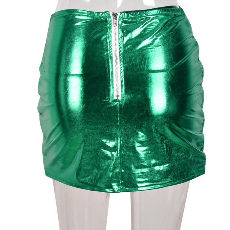 A stylish green women's puffer skirt with a metallic shiny finish, featuring a quilted design and zipper closure, perfect for various occasions.