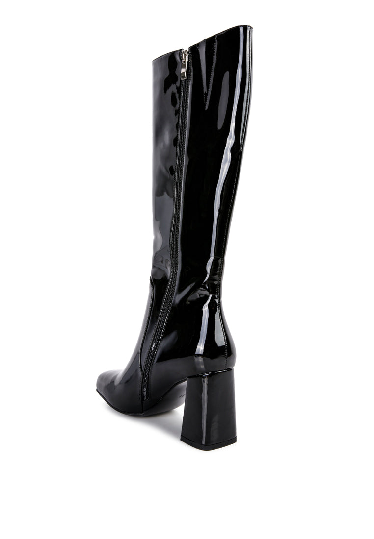 A pair of stylish Hypnotize Patent PU Block Heeled Calf Boots featuring a square toe, mid block heel, and side zipper opening.