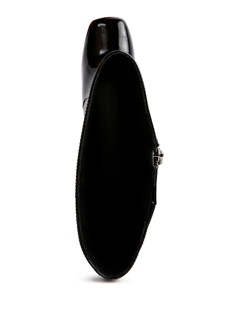 A pair of stylish Hypnotize Patent PU Block Heeled Calf Boots featuring a square toe, mid block heel, and side zipper opening.