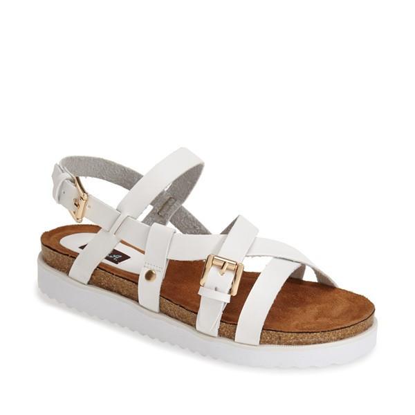 Stylish JAXON sandals made from vegan PU leather featuring strappy details and a padded footbed with a side buckle closure.