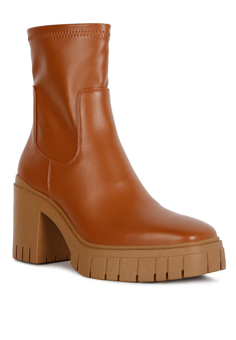 Kokum Faux Leather Platform Ankle Boots featuring a sleek design, sturdy lug sole, and side zipper opening, perfect for stylish women.