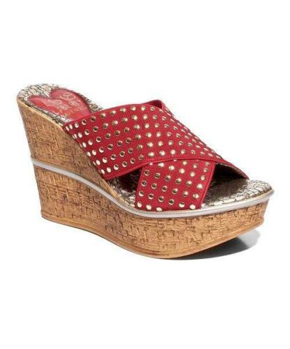 Stylish Manhattan studded wedges with a leather upper and cork wedge outsole, featuring a snake print sock liner.