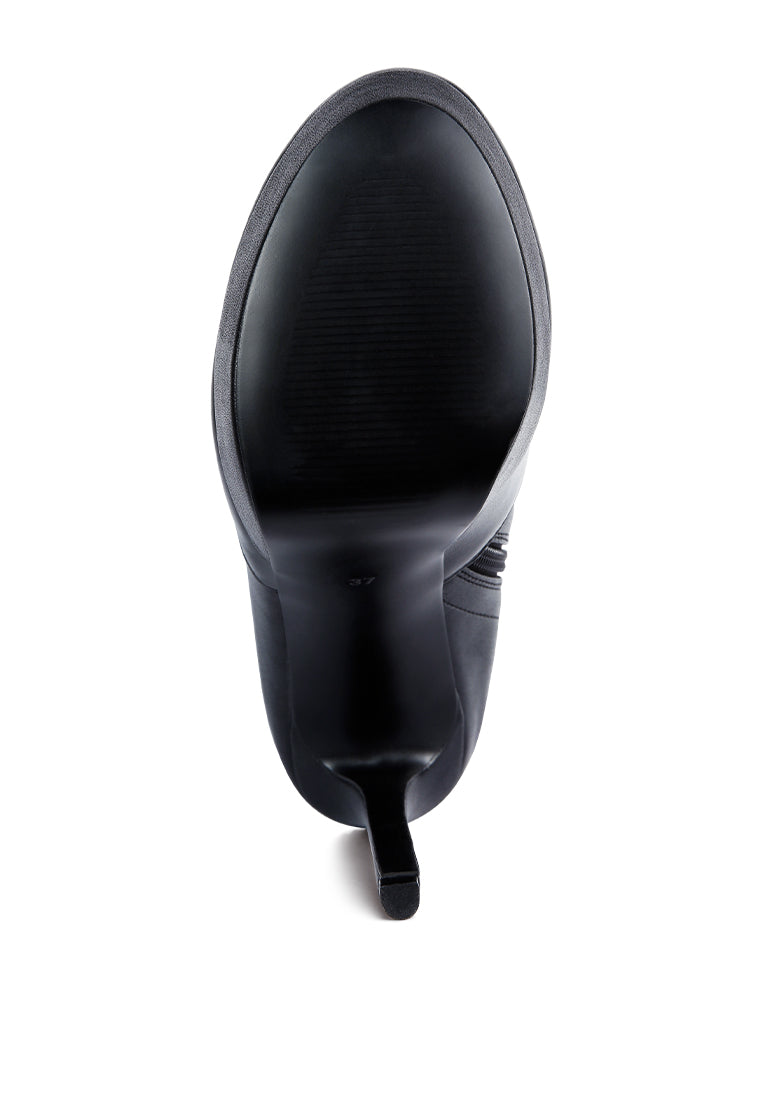 Marvelettes Faux Leather High Heeled Long Boots featuring a pointed toe, high platform, and stylish over-the-knee design with side zipper.