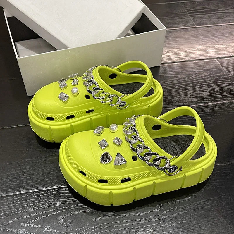 A pair of stylish Sexikinis Platform Slippers in green, black, and white, perfect for summer beach outings.