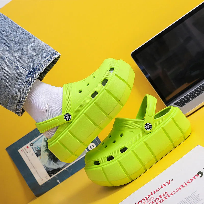 A pair of stylish Sexikinis Platform Slippers in green, black, and white, perfect for summer beach outings.