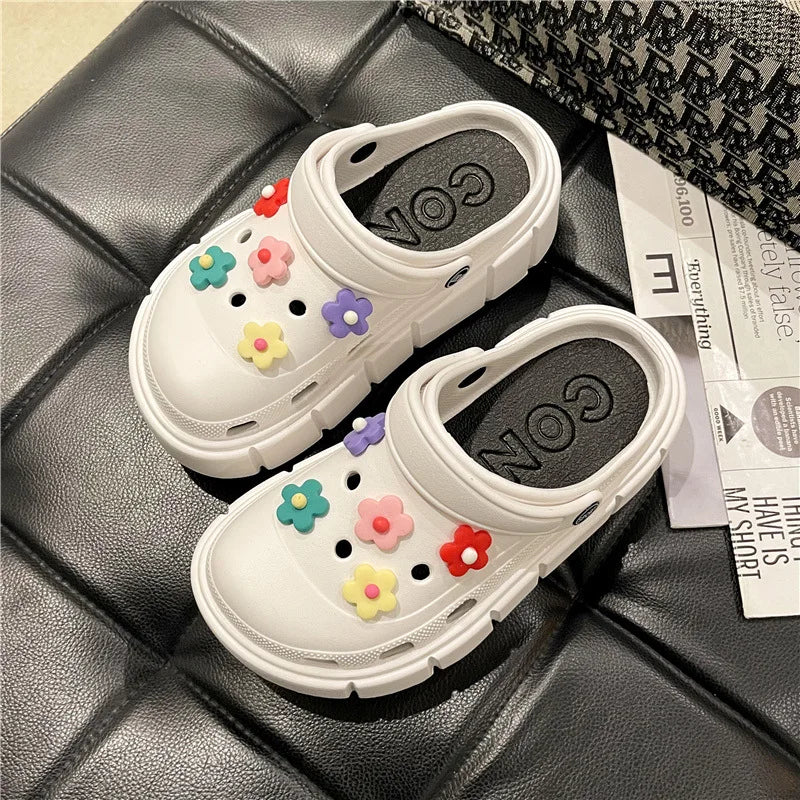 A pair of stylish Sexikinis Platform Slippers in green, black, and white, perfect for summer beach outings.