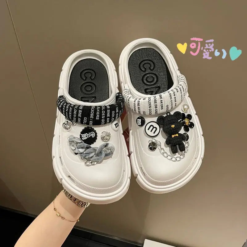 A pair of stylish Sexikinis Platform Slippers in green, black, and white, perfect for summer beach outings.