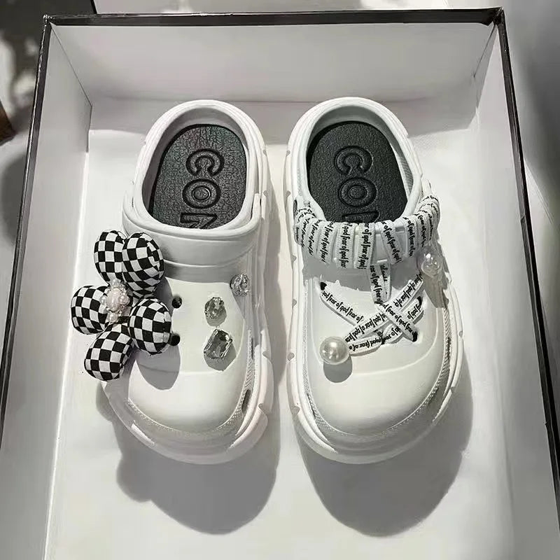 A pair of stylish Sexikinis Platform Slippers in green, black, and white, perfect for summer beach outings.