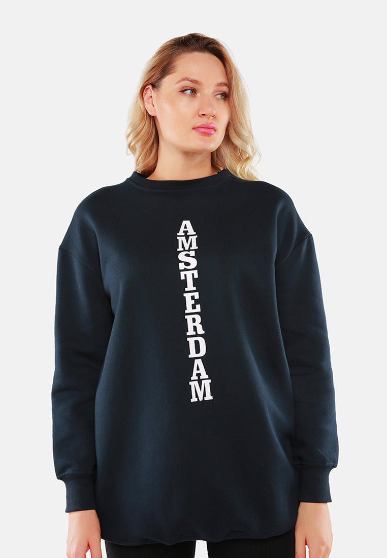 A cozy Printed Oversized Live-In Sweatshirt featuring a trendy print, relaxed fit, and full sleeves, perfect for casual outings and indoor gatherings.