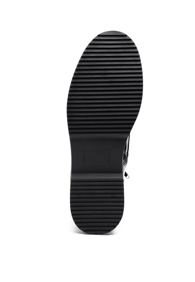 Rubble Statement PU Lace Up Ankle Boots featuring a shiny patent finish, lace-up details, and a side zip opening for easy wear.