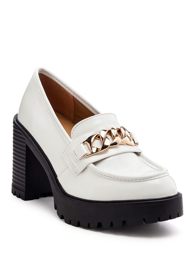Sachs Block Heeled Chunky Loafers in patent faux leather with metal chain detail, showcasing a stylish and elegant design.