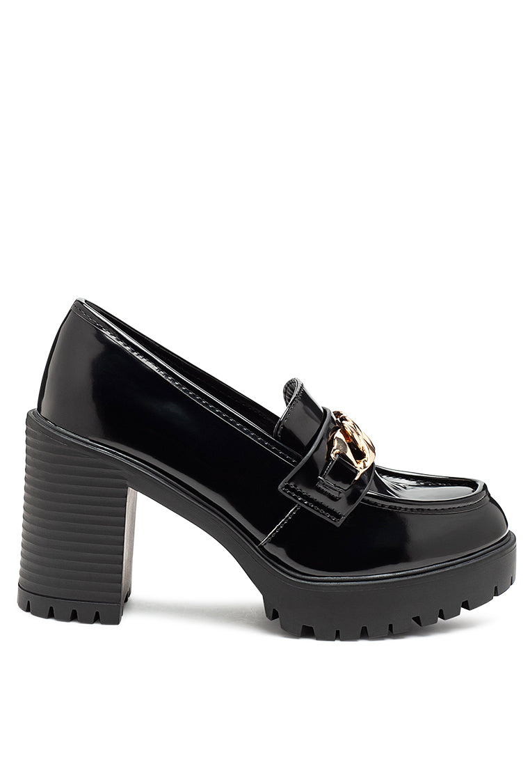 Sachs Block Heeled Chunky Loafers in patent faux leather with metal chain detail, showcasing a stylish and elegant design.