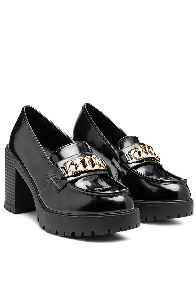 Sachs Block Heeled Chunky Loafers in patent faux leather with metal chain detail, showcasing a stylish and elegant design.
