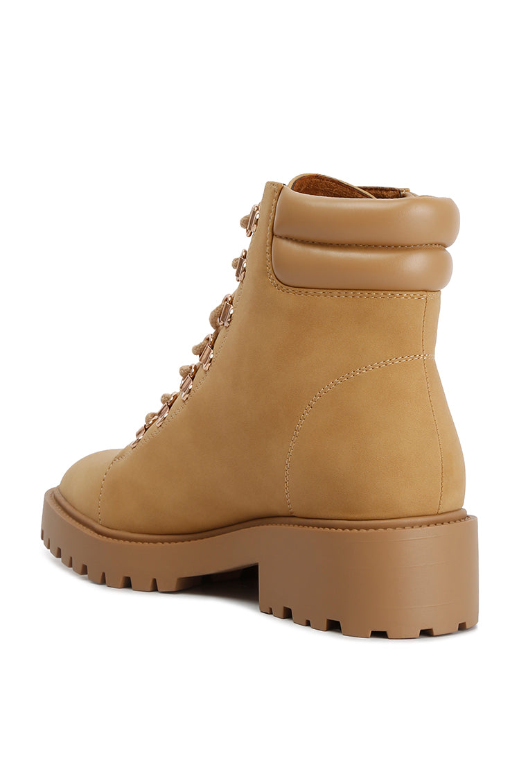 Shirly Quilt Collared Ankle Boots in beige with dark brown rim and metallic eyelets, showcasing a stylish design.