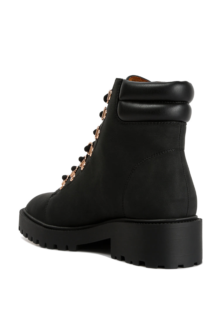 Shirly Quilt Collared Ankle Boots in beige with dark brown rim and metallic eyelets, showcasing a stylish design.