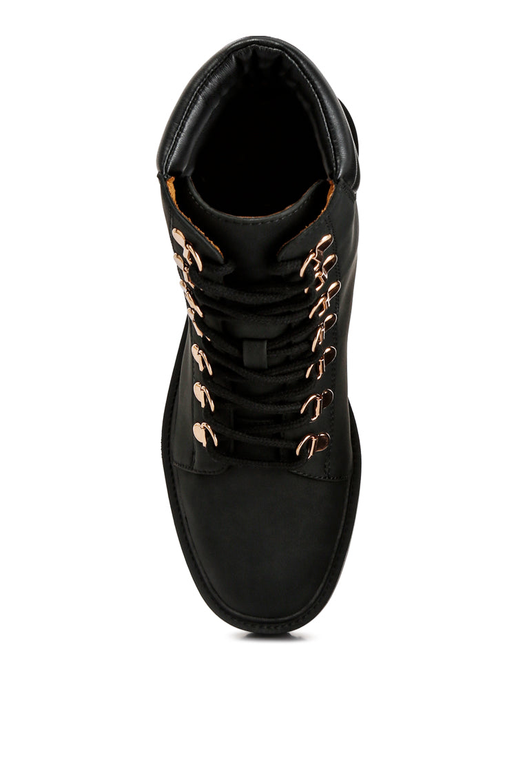 Shirly Quilt Collared Ankle Boots in beige with dark brown rim and metallic eyelets, showcasing a stylish design.