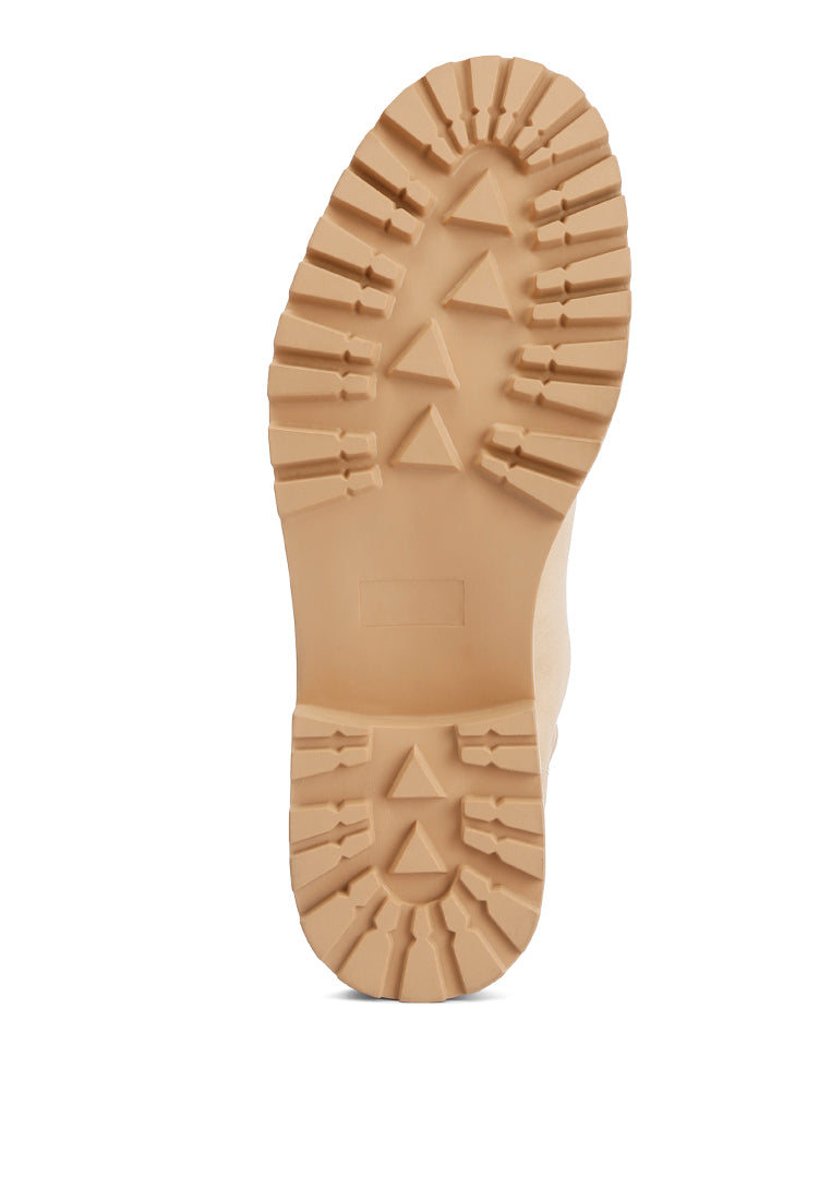 Shirly Quilt Collared Ankle Boots in beige with dark brown rim and metallic eyelets, showcasing a stylish design.