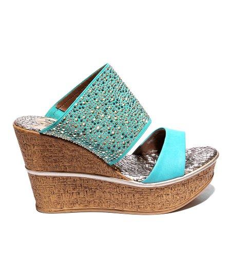 A stylish high wedge heel named Spring Fling, featuring an ornamented upper in vibrant colors, perfect for spring outings.