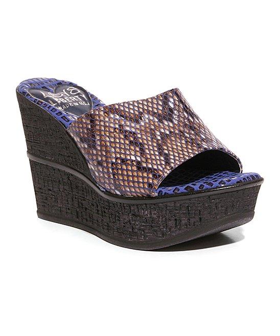 Stylish snakeskin leather wedges with high cork wedge outsole, perfect for any occasion.