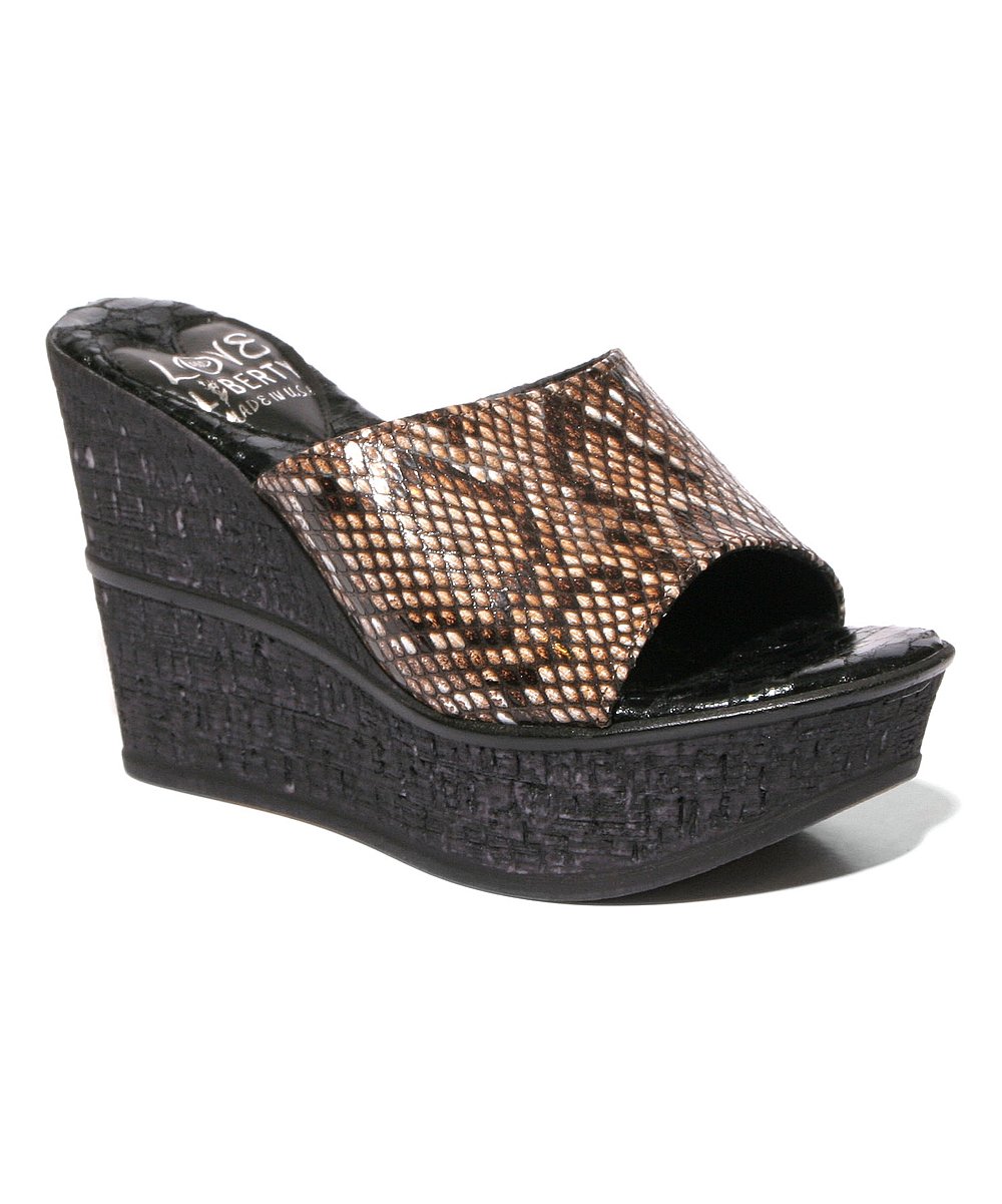 Stylish snakeskin leather wedges with high cork wedge outsole, perfect for any occasion.