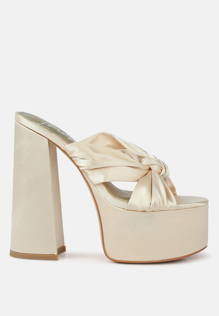 A pair of elegant Strobing Knotted Chunky Platform Heels featuring a satin knotted strap and chunky platform design, perfect for special occasions.