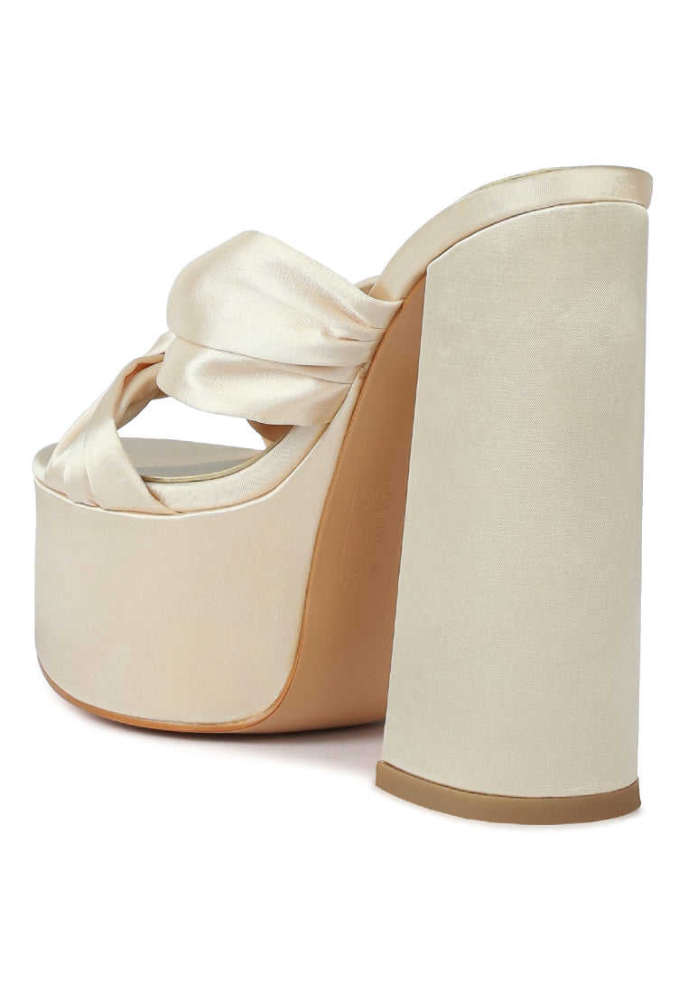 A pair of elegant Strobing Knotted Chunky Platform Heels featuring a satin knotted strap and chunky platform design, perfect for special occasions.
