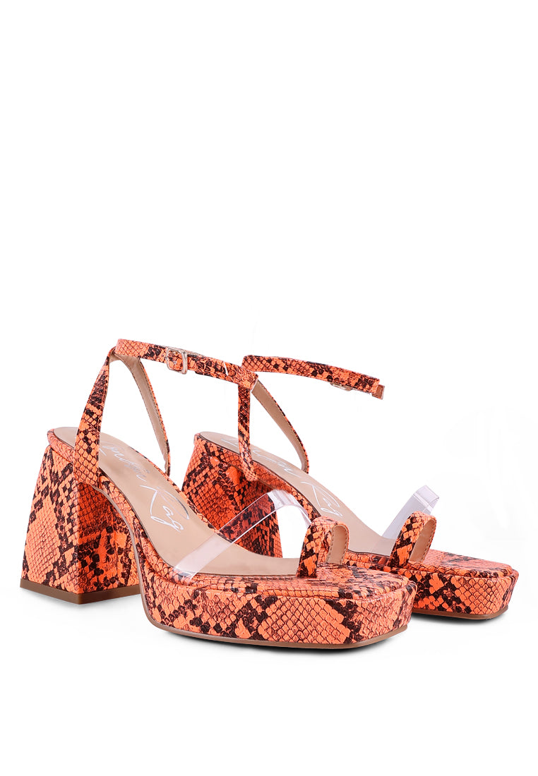 Such Flirt Snake Print Triangular Block Heel Sandals featuring a clear strap, toe ring, and chunky block heel in a stylish snakeskin print.