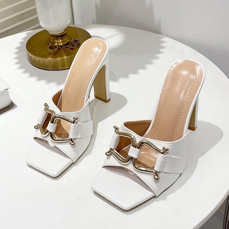 A pair of stylish high-heeled women's shoes with a square toe design, available in white, black, apricot, and denim blue, showcasing their elegant look.
