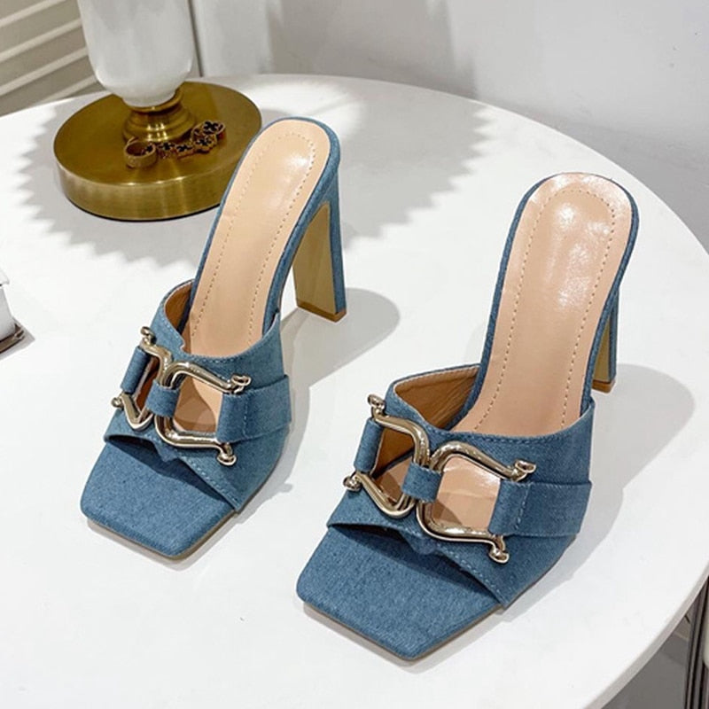 A pair of stylish high-heeled women's shoes with a square toe design, available in white, black, apricot, and denim blue, showcasing their elegant look.