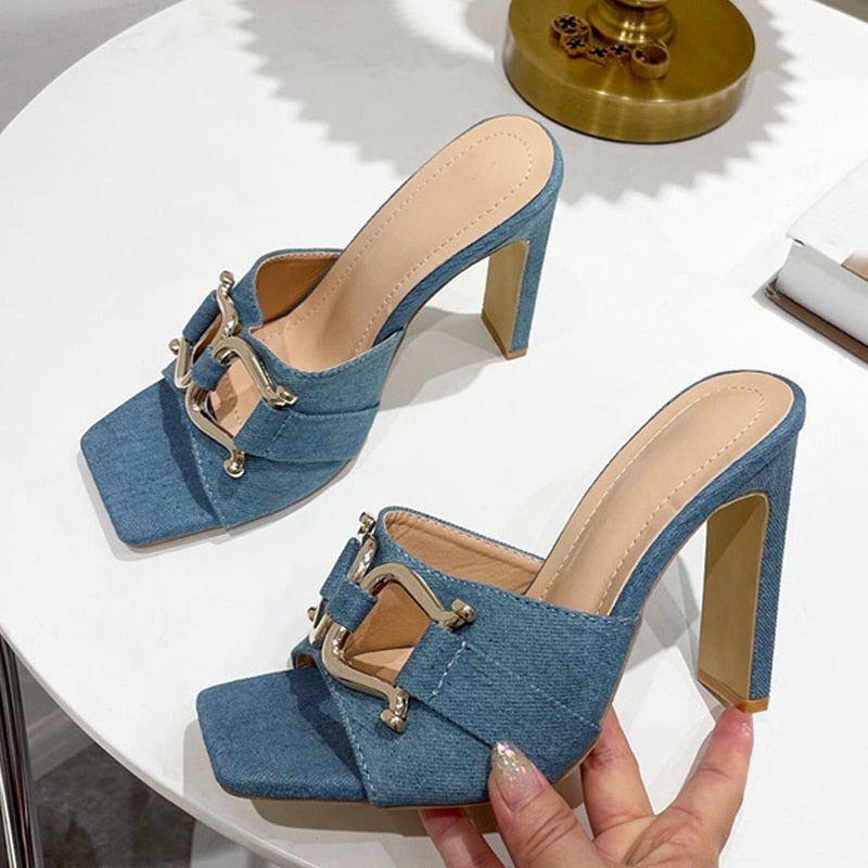 A pair of stylish high-heeled women's shoes with a square toe design, available in white, black, apricot, and denim blue, showcasing their elegant look.