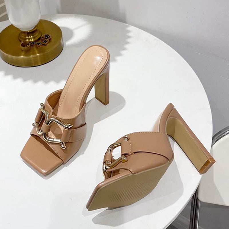 A pair of stylish high-heeled women's shoes with a square toe design, available in white, black, apricot, and denim blue, showcasing their elegant look.