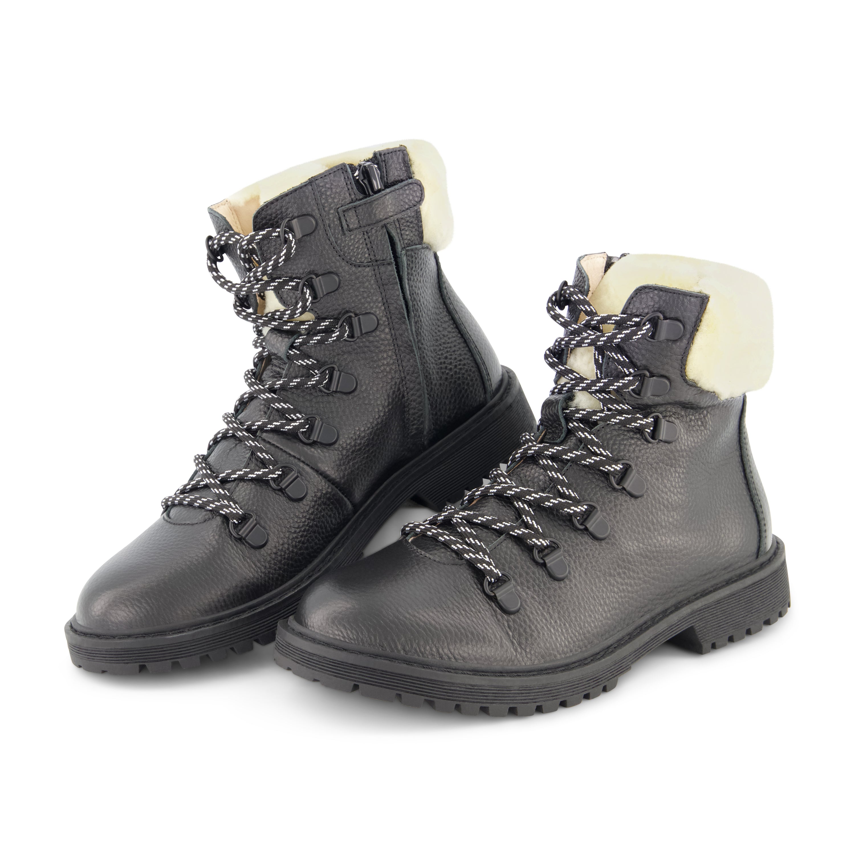 The Bandit black booties featuring a sleek exterior and luxurious sherpa back, designed for comfort and style.